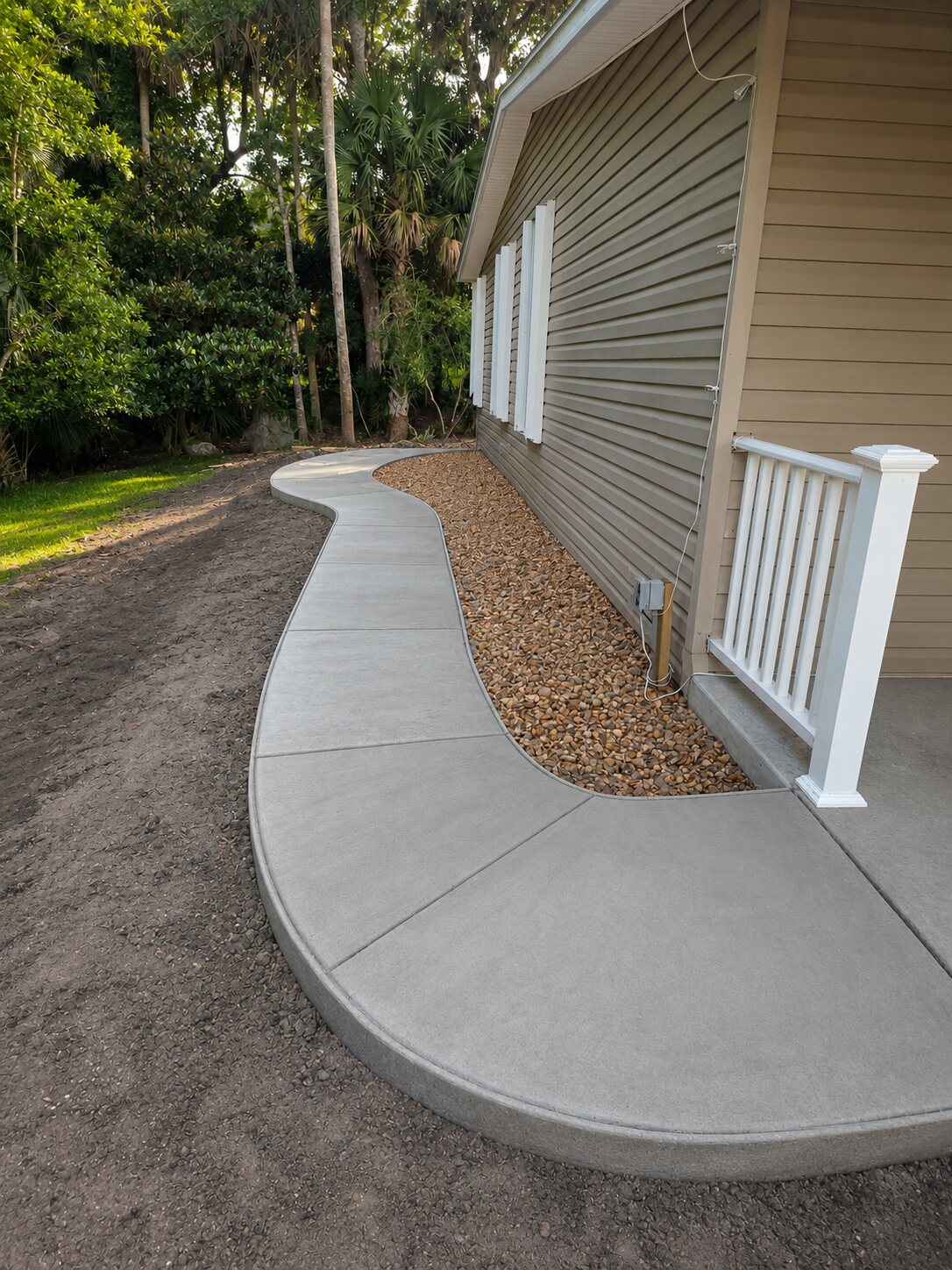 Concrete sidewalk phase planned to continue toward the patio