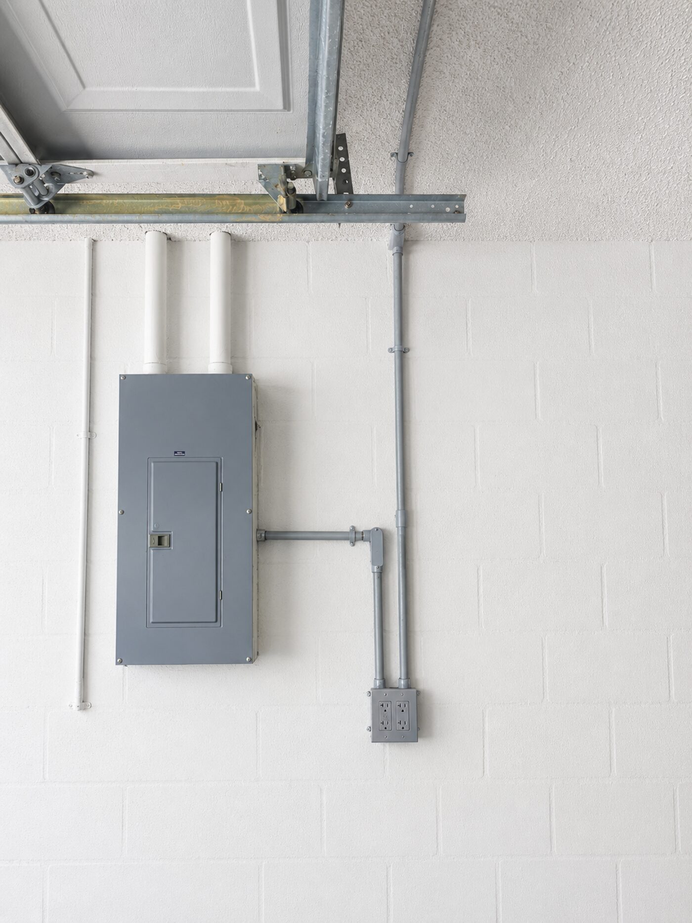 New conduit running from the main panel to a garage outlet box