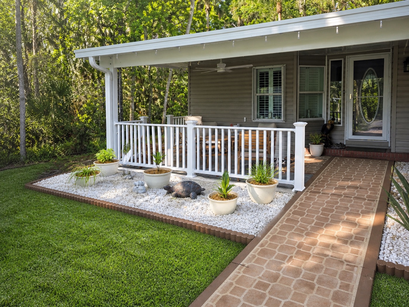 Porch with stone garden bed and brick walkway